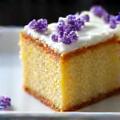 Slice of gourmet lavender honey cake with delicate sugar decoration